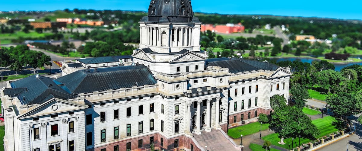 A large, historic building with a prominent dome and classical architecture.
