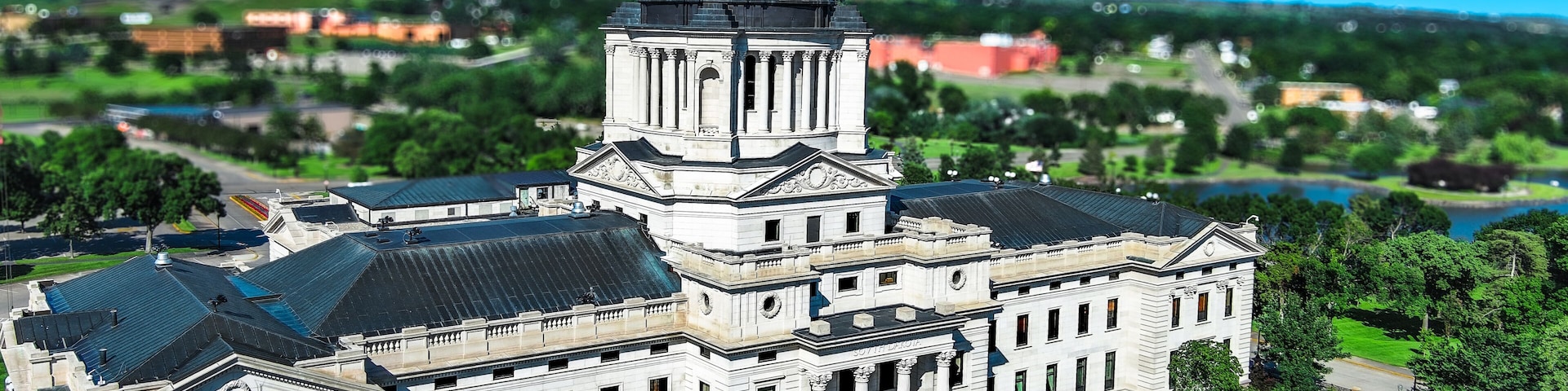 A large, historic building with a prominent dome and classical architecture.