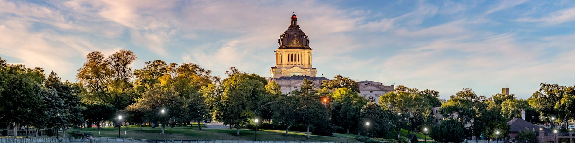 Illuminated South Dakota State Capitol at sunset