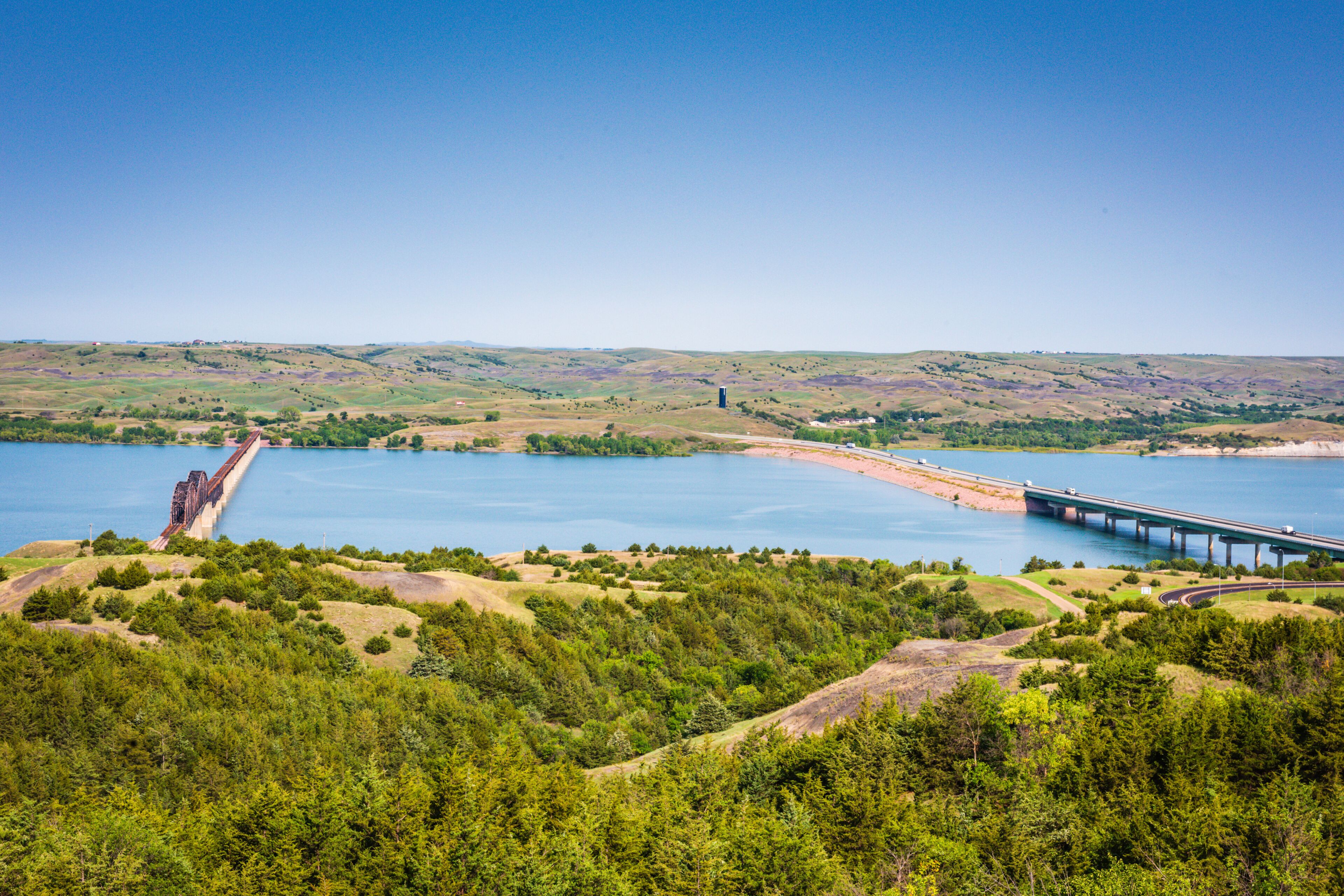Scenic overlook on bluffs offers views of two Missouri River Bridges in South Dakota: Chamberlain Bridge and Lewis and Clark Memorial Bridge.