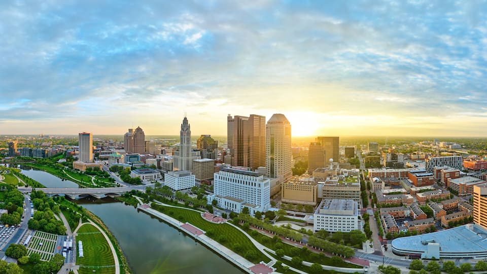 Panorama Columbus Ohio downtown at sunrise with river aerial drone shot