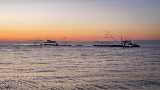 There is a lot more to Pisa than the famous Leaning Tower!
If you get some extra time, I would recommend you hit the Marina di Pisa. It is only a 20 mins drive from the city, and in my opinion it is worth the detour.
The walk at sunset by the Arno bank in the estuary is brilliant. This is from there that I got this photo of those fishing huts.
Also, the Yacht Club in the middle of the marina is an amazing spot to watch sunset and enjoy a Spritz!