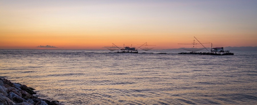 There is a lot more to Pisa than the famous Leaning Tower!
If you get some extra time, I would recommend you hit the Marina di Pisa.  It is only a 20 mins drive from the city, and in my opinion it is worth the detour.
The walk at sunset by the Arno bank in the estuary is brilliant.  This is from there that I got this photo of those fishing huts.
Also, the Yacht Club in the middle of the marina is an amazing spot to watch sunset and enjoy a Spritz!