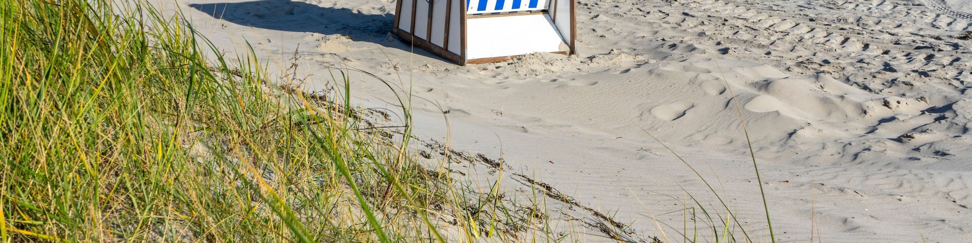 Beach chair with dunes on the island of Rügen on the Baltic Sea
