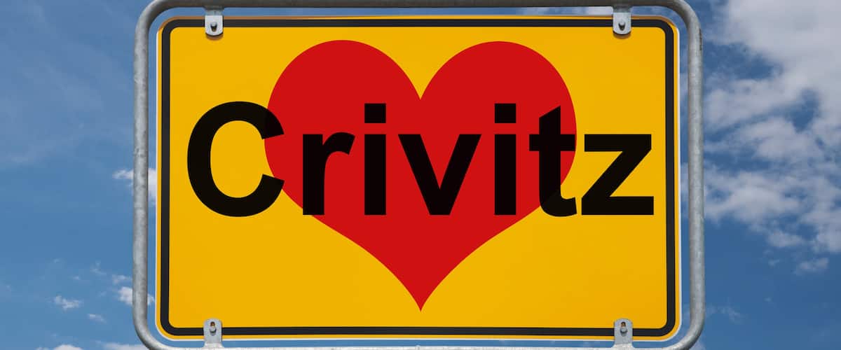 A sign with the word 'Crivitz' and a red heart symbol.