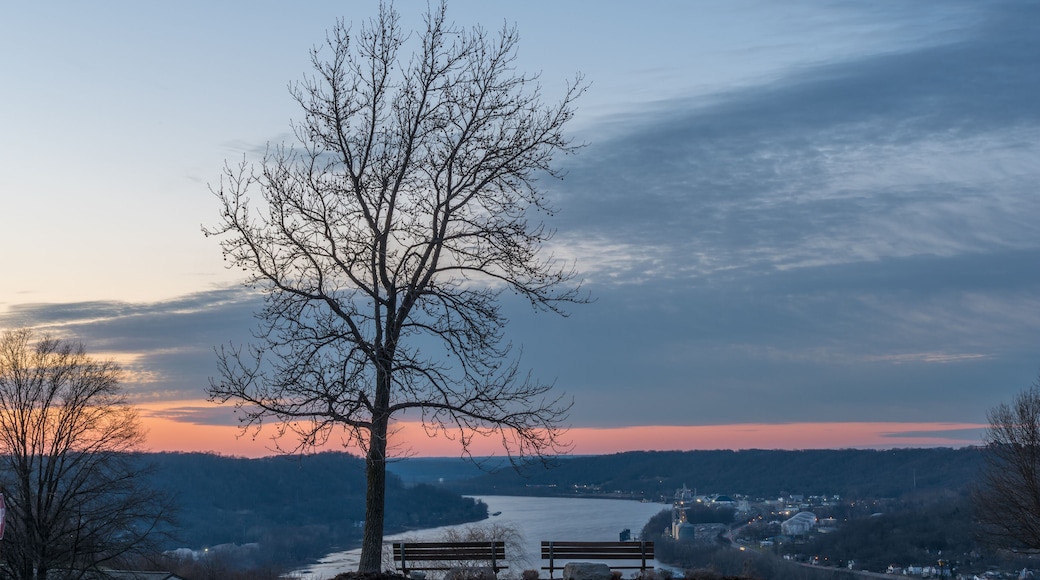 peaceful sunset next to the park benches