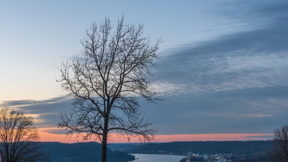 peaceful sunset next to the park benches