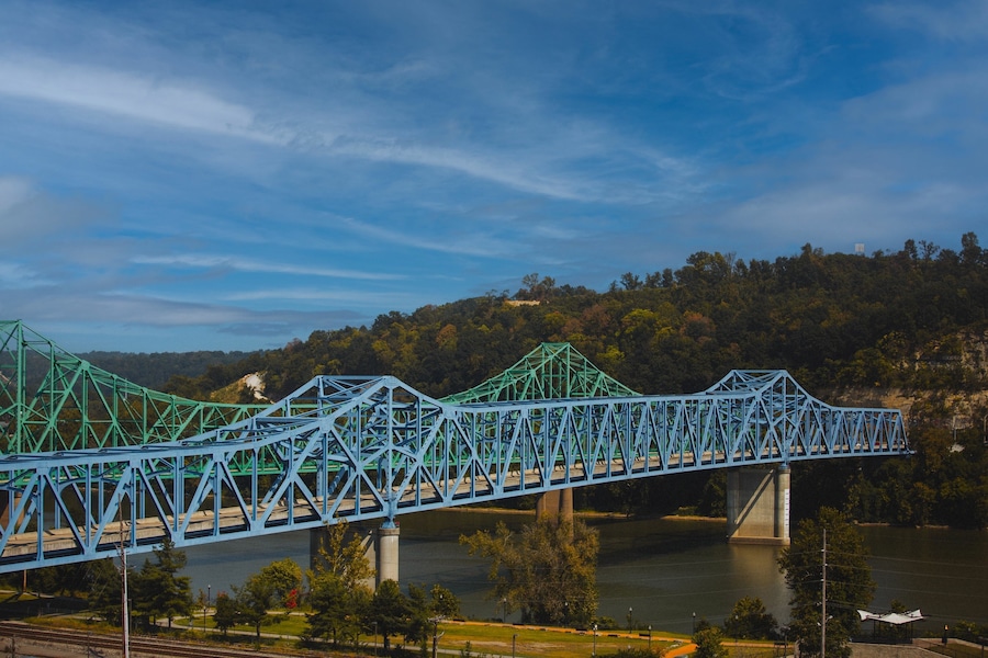 Scenic shot of the blue Owensboro Bridge against the green valley background in Indiana
