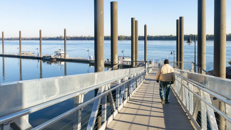 A large floating pier on the Ohio River at Paducah, Kentucky with a man walking down the ramp.