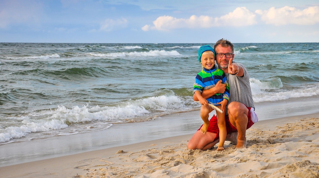 Dad and son on the beach - sunset on the Baltic Sea