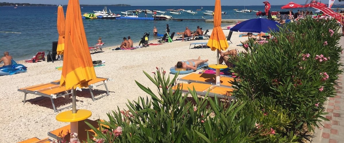 The beach at Bi Village campsite in Croatia. Looking out over the Mediterranean Sea it's a great place to soak up the atmosphere and sun.
This area of the coastline is very picturesque as is the whole area.
