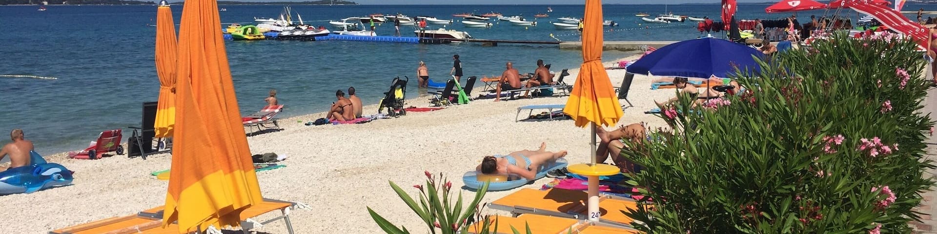 The beach at Bi Village campsite in Croatia. Looking out over the Mediterranean Sea it's a great place to soak up the atmosphere and sun.
This area of the coastline is very picturesque as is the whole area.