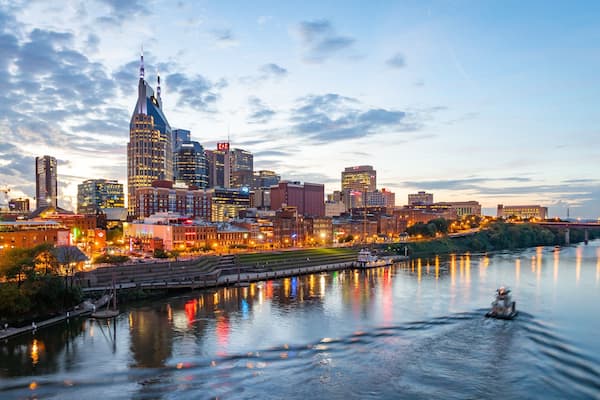 Downtown Nashville which includes a city, a sunset and boating