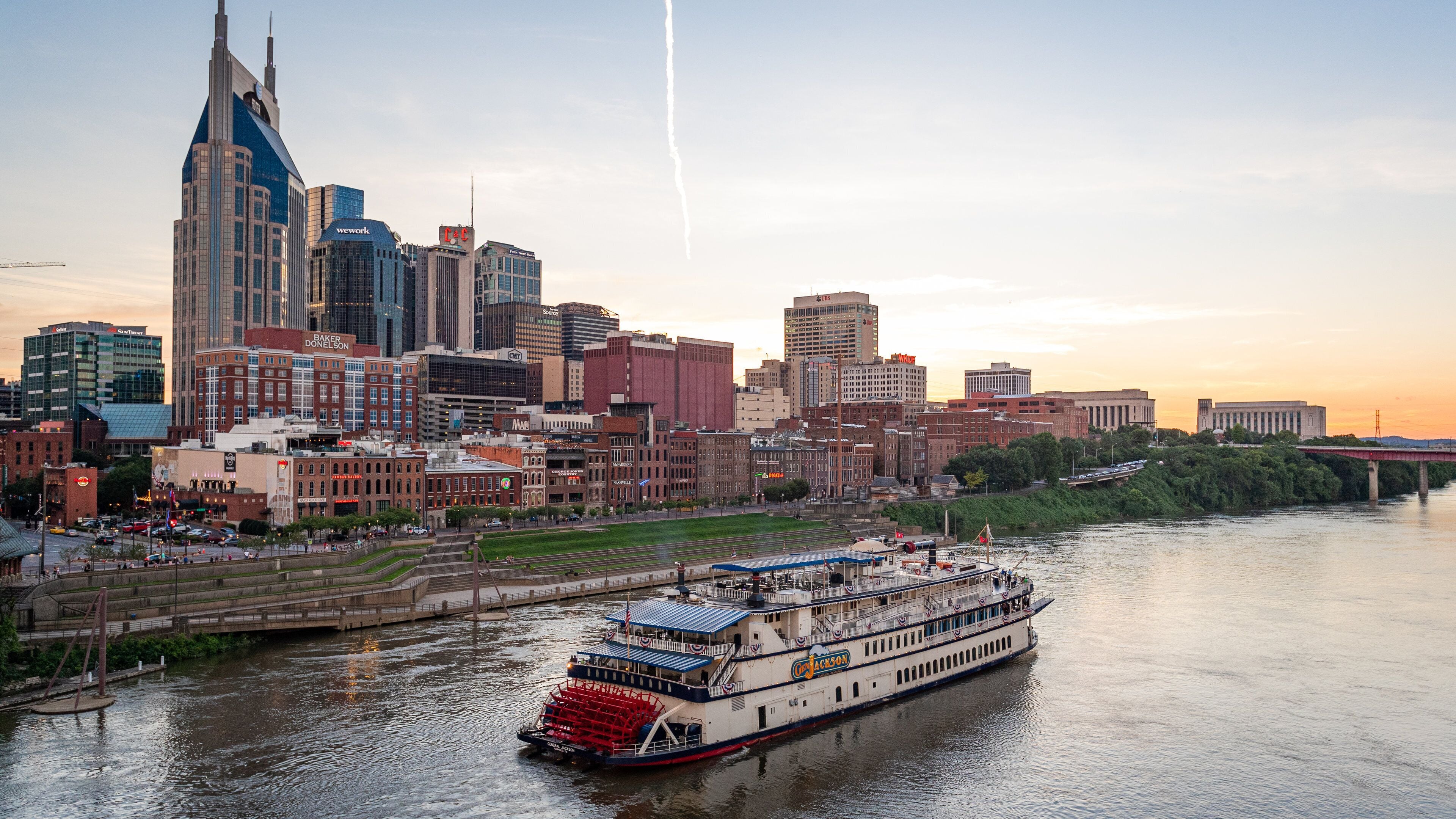 Downtown Nashville which includes landscape views, a river or creek and a sunset