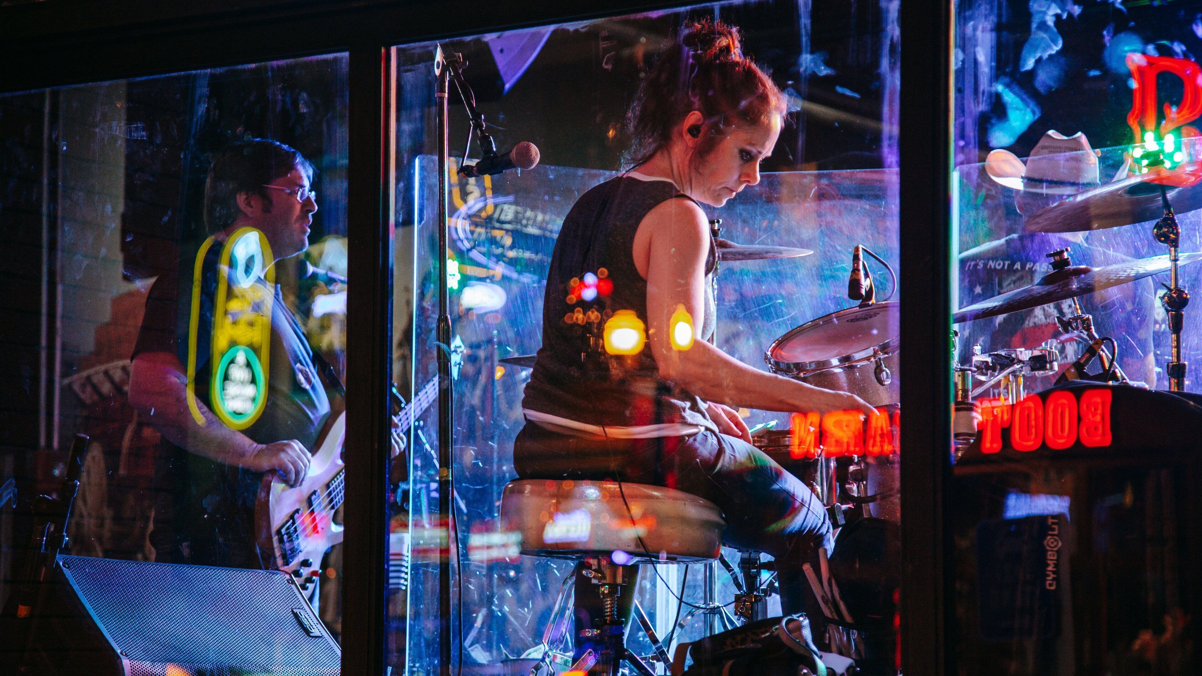 Music Row featuring performance art and music as well as an individual femail