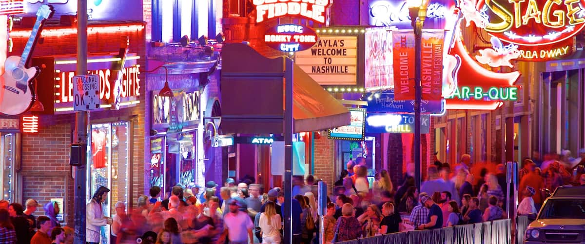 Vanderbilt University - Music Row which includes signage, night scenes and a city