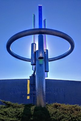 "Transformations" - a sculpture by artist Howard Meehan composed of polished stainless steel and dichroic glass.