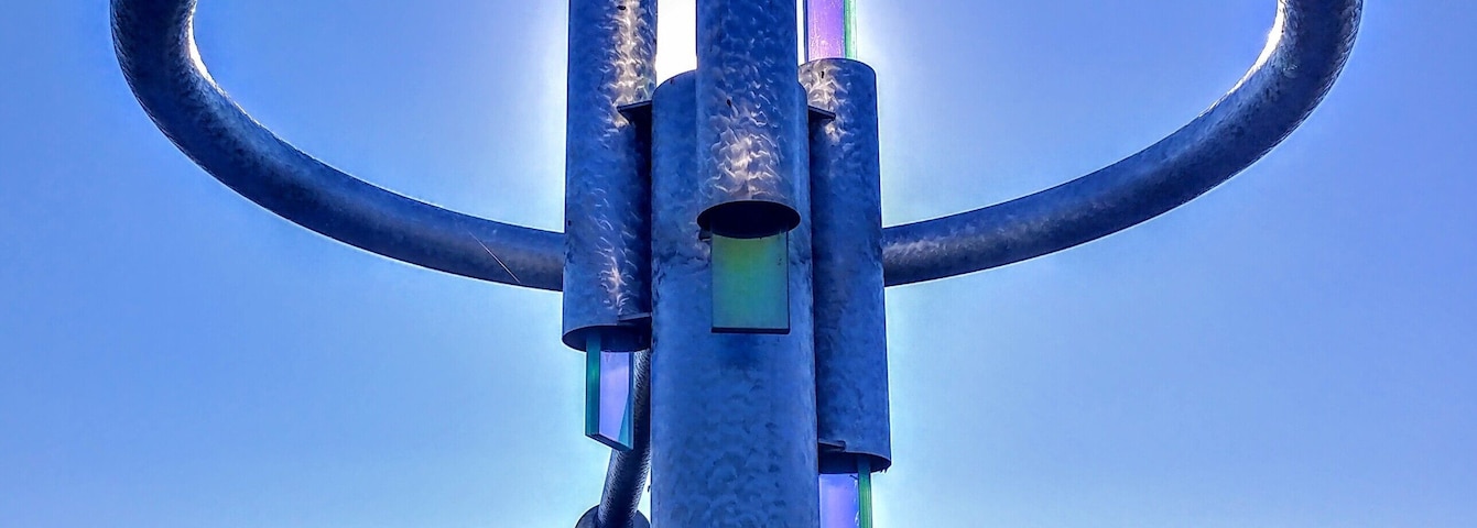 "Transformations" - a sculpture by artist Howard Meehan composed of polished stainless steel and dichroic glass.