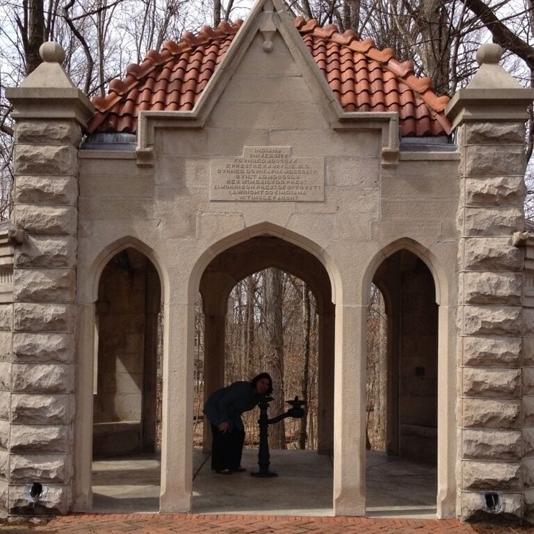 Near the Wells statue.