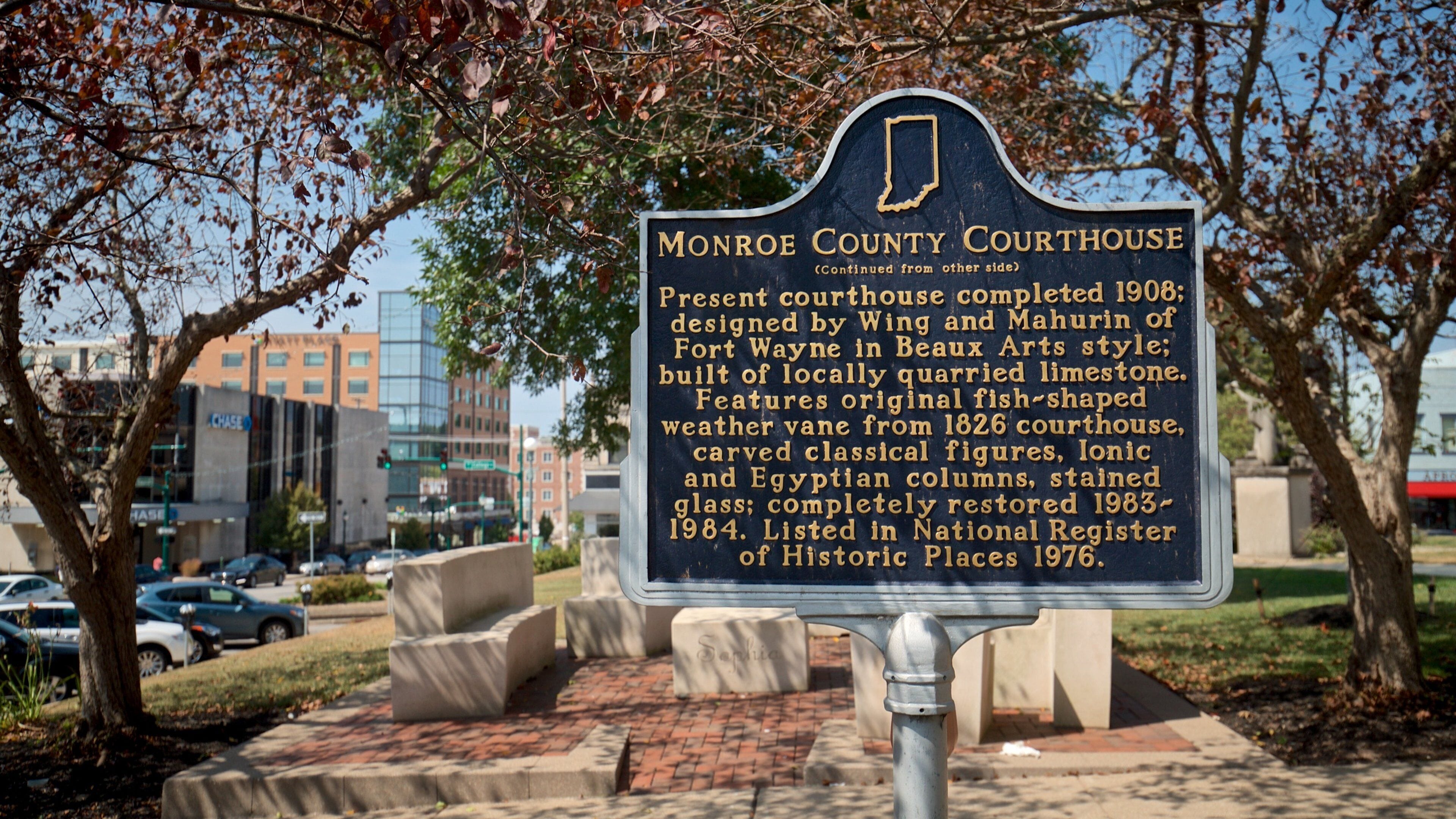 A courthouse sign with historical details.