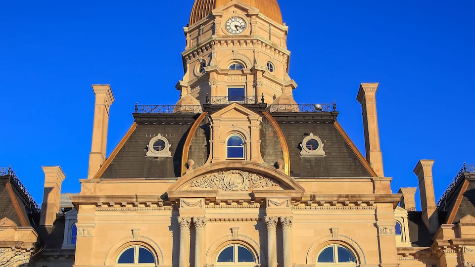 A large building with a prominent dome and clock tower.