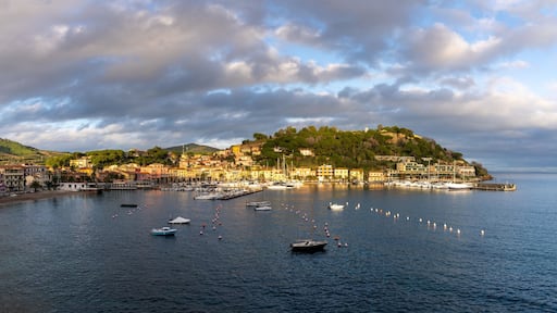 panorama view of the harbor marina and Porto Azzurro village on Elba Island at sunset