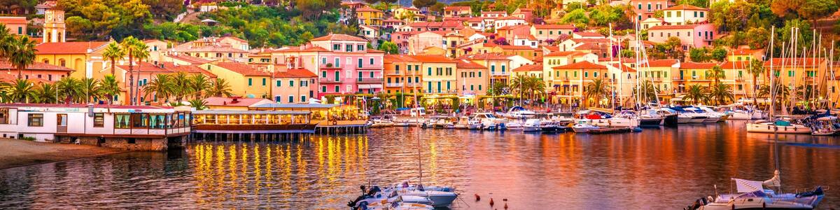 Harbor and village Porto Azzurro at sunset, Elba islands, Tuscany, Italy.