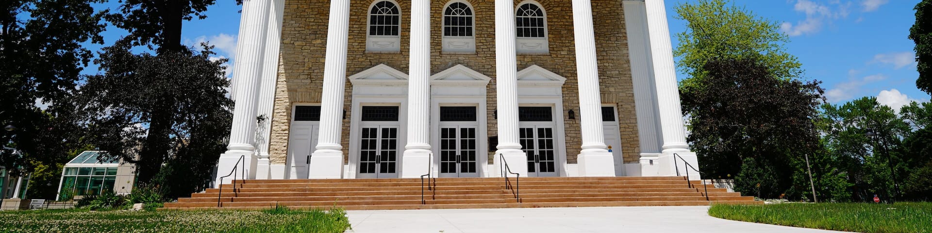 A white building with columns and a steeple, labeled 'Lawrence Memorial Chapel.'