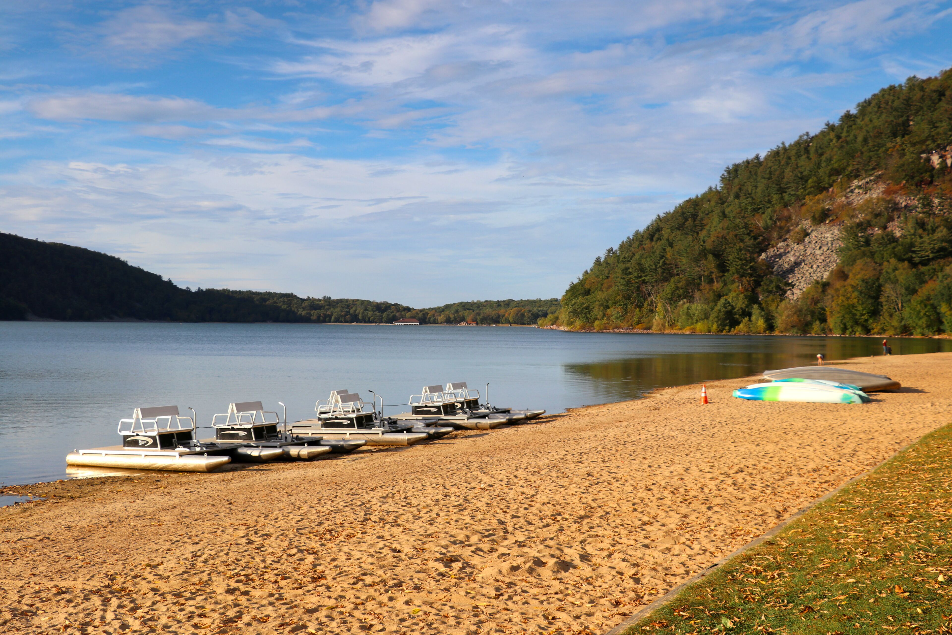 Beautiful Wisconsin nature background. Scenic view with boats and catamarans on a lake beach. Devils Lake State Park south shore, Baraboo area, Wisconsin, Midwest USA.