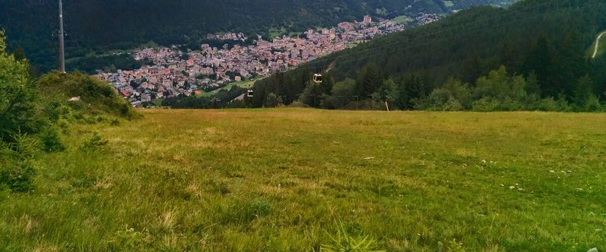 A mountainous landscape with a town nestled in the valley.