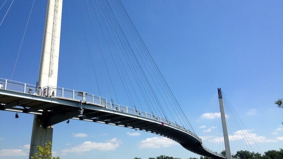 A cable-stayed bridge with a pedestrian walkway.