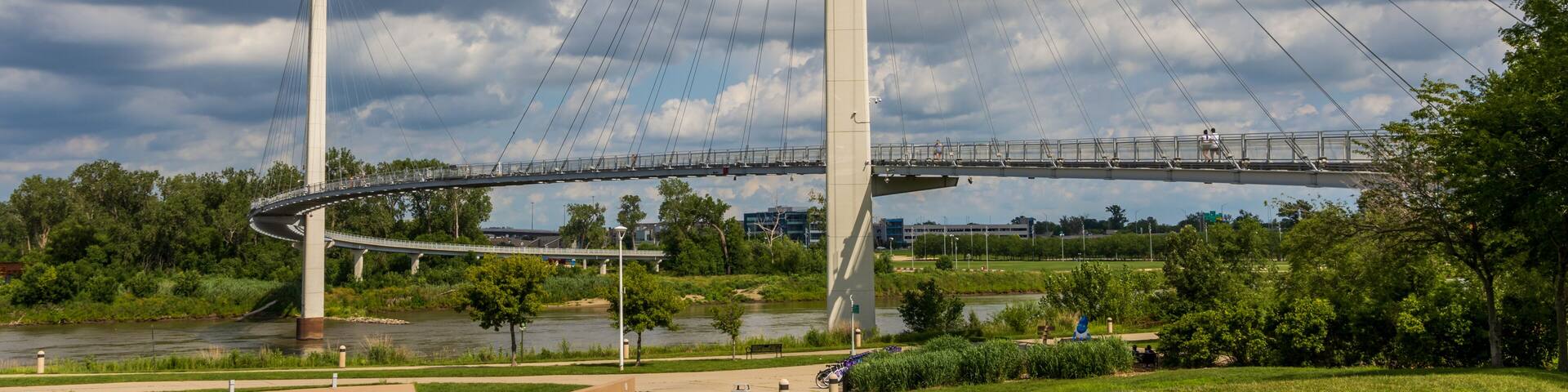 The Bob Kerrey Pedestrian Bridge crosses over the Missouri river, connecting Omaha, Nebraska with Council Bluffs, Iowa