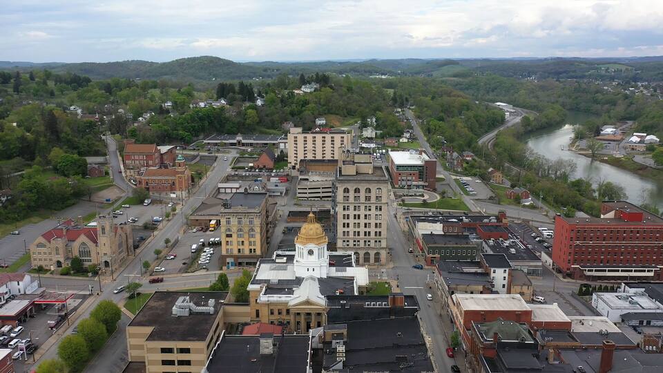 The Marion County courthouse in Fairmont, WV, and the surrounding small town and countryside in the appalachian mountains.