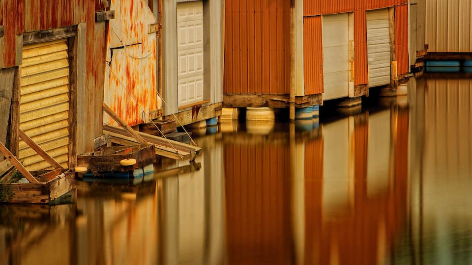 Boathouses Reflecting off Mississippi River in Minnesota