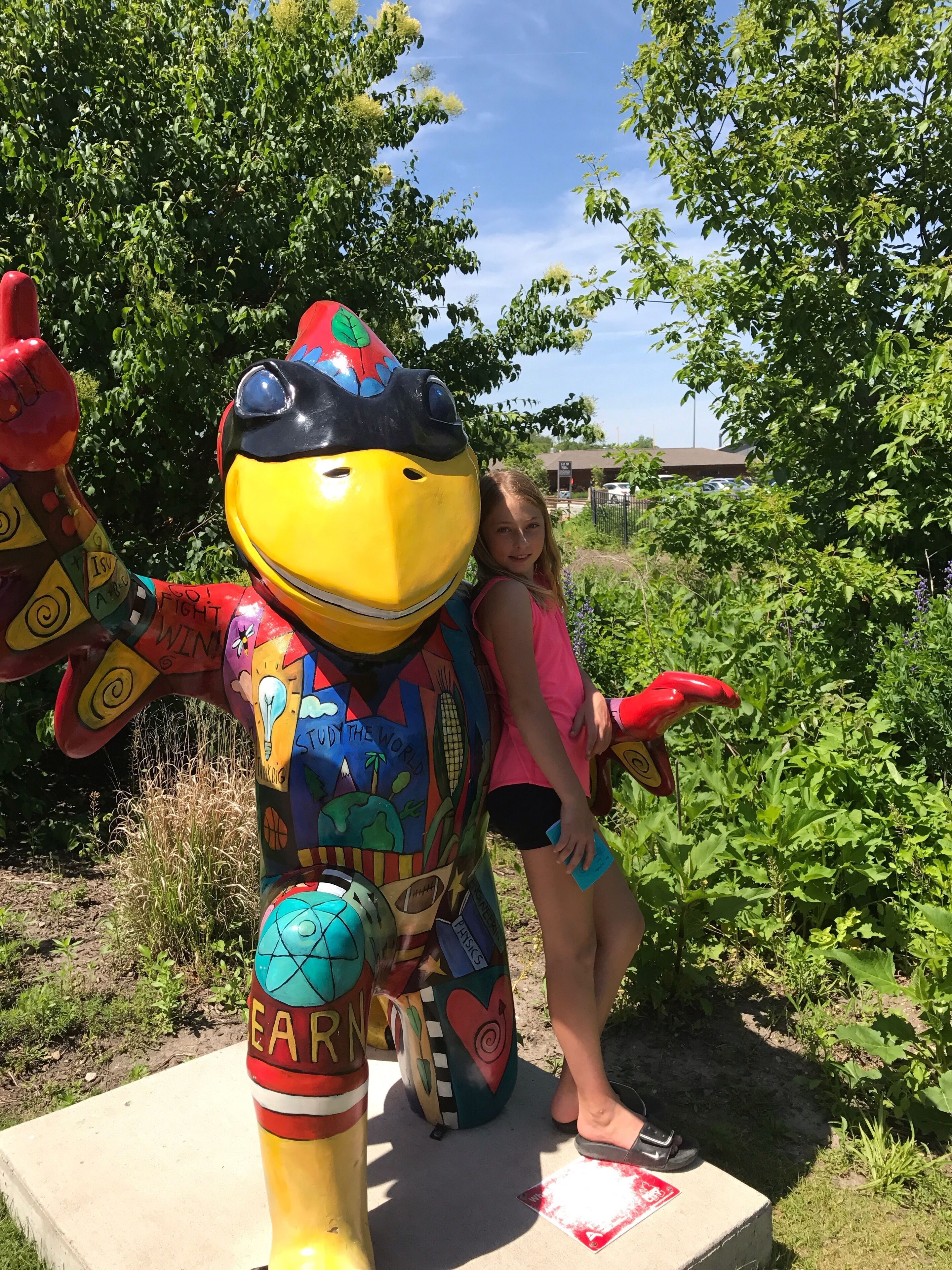 This is me at rimon gardens. I like taking photos with all the CYs in Ames . It is a fun place to go because they are always changing the exhibits. It is pretty cool.