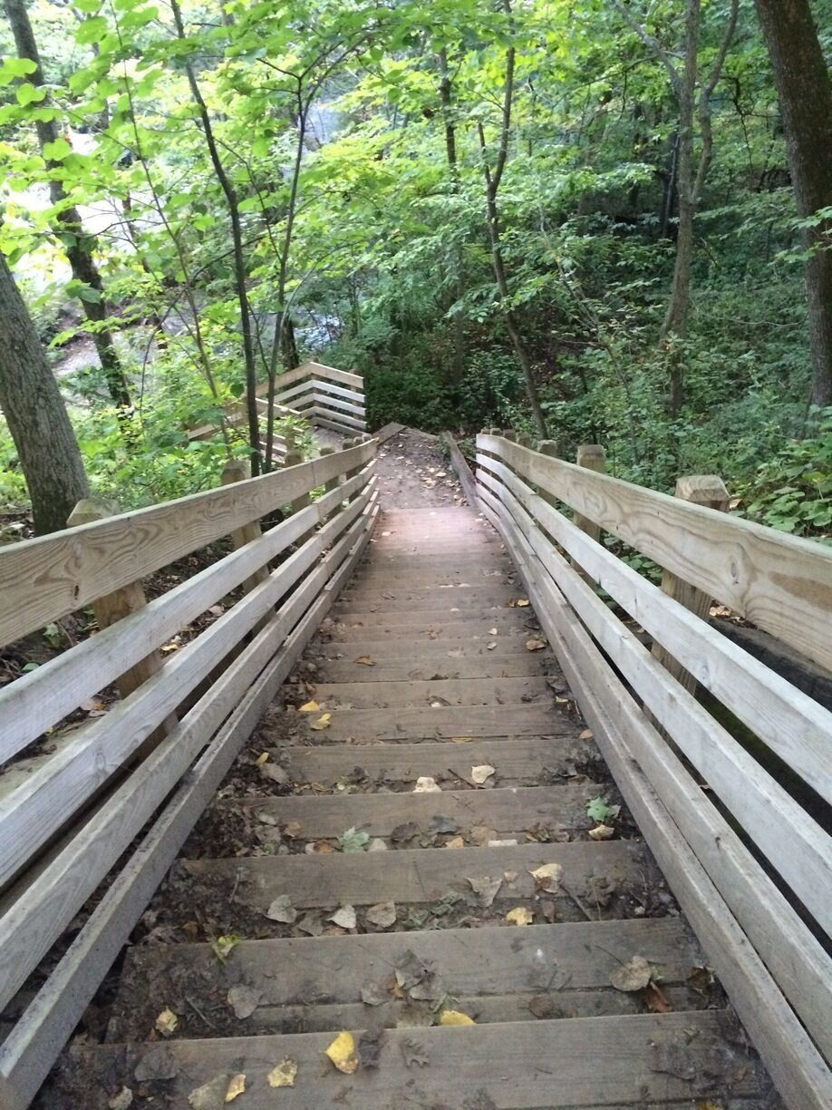 Beautiful park full of hiking trails and boardwalks with a view of the waterfall.