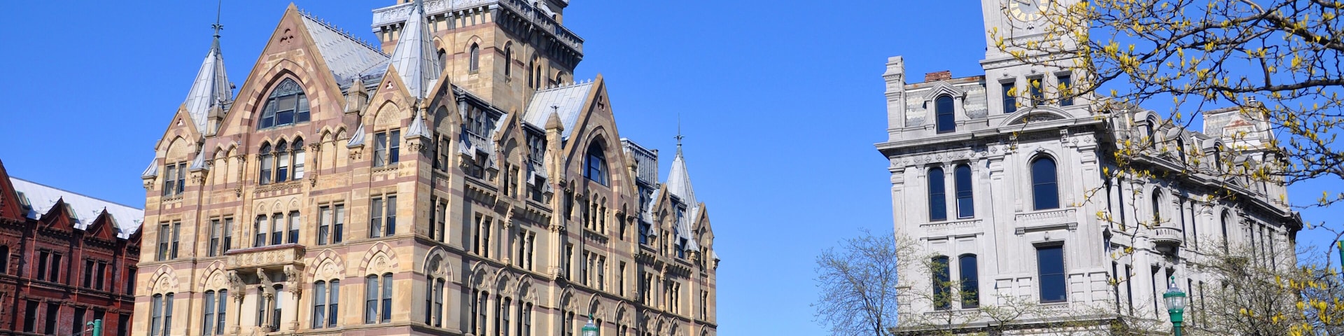 Syracuse savings Bank Building (left) and Gridley Building (right) at Clinton Square in downtown Syracuse, New York State, USA. Syracuse Savings Bank Building was built in 1876 with Gothic style.