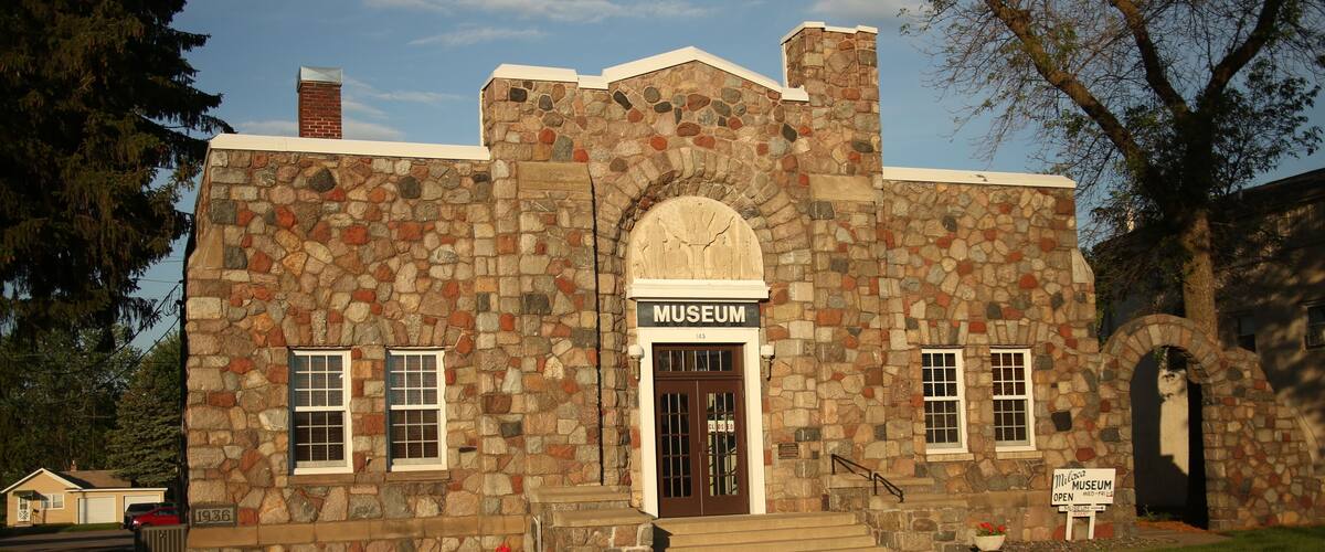 A stone building with a sign that reads "Museum."