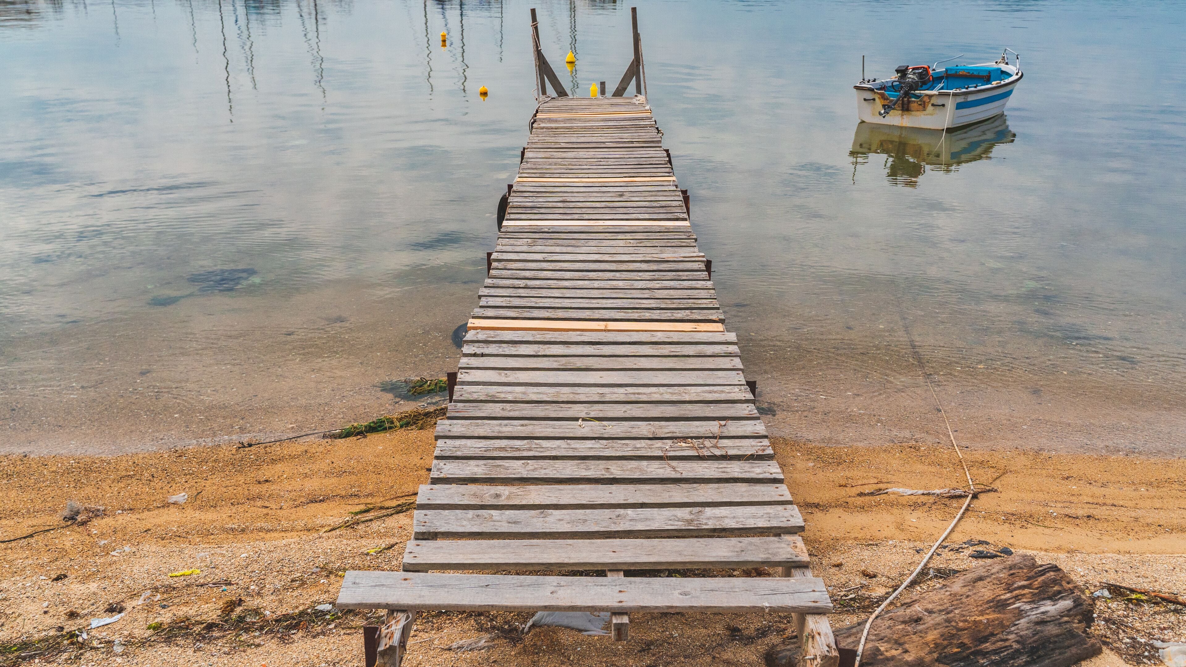 wooden pier at beach in Greece