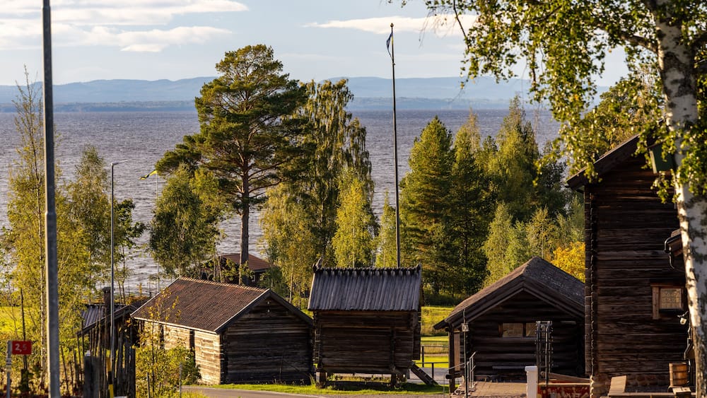 Tällberg, Sweden A landscape with traditional wooden houses typical of the Dalarna region.