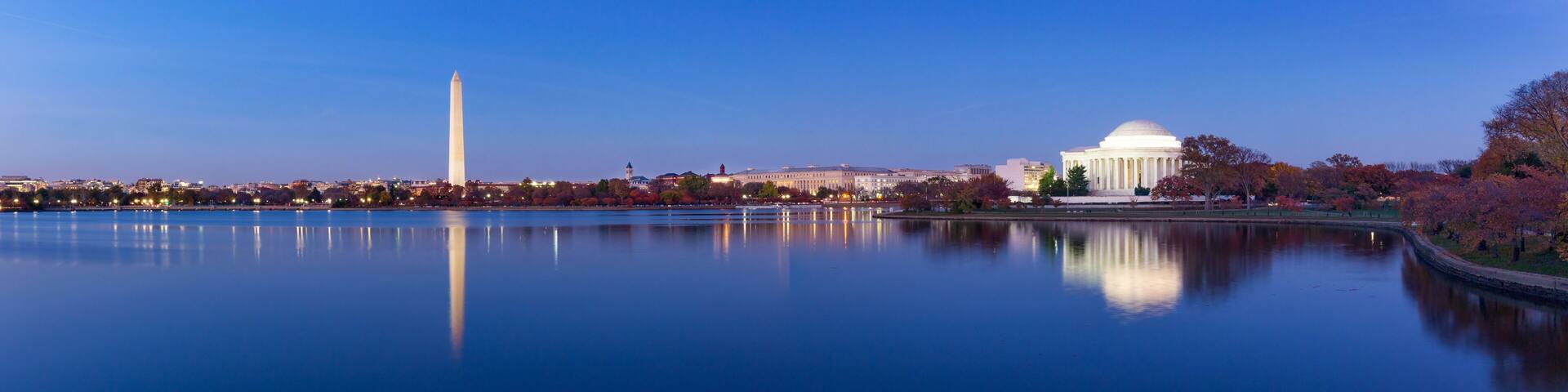 Jeffeerson Memorial and Washington Monument reflected on Tidal Basin in the evening, Washington DC, USA. Panoramic image
