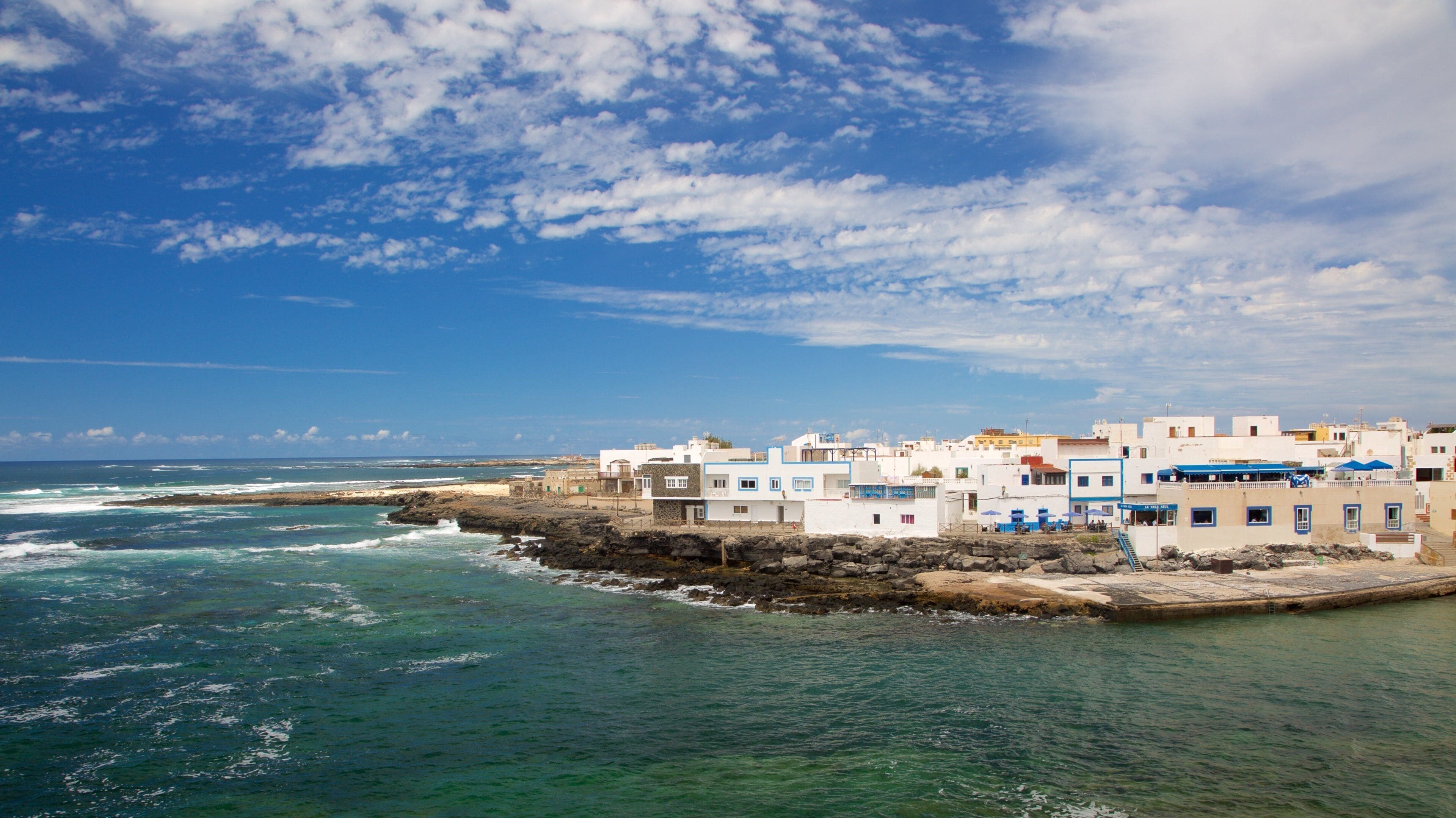 El Cotillo featuring rugged coastline, a coastal town and general coastal views