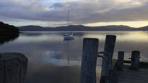 Stewart Island is the New Zealand island south of the South Island. The only town, Oban has a small population, but the majority of the island is very seldom visited. Some parts are reachable by hiking trail while others like the bay in the south are only reachable by boat.
