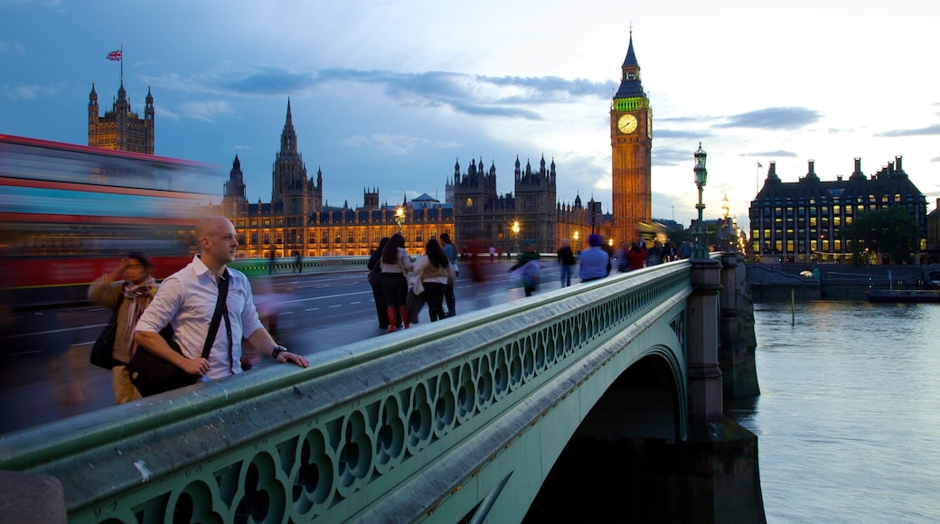 Iconic Big Ben stands tall in the evening sky of London with a vibrant atmosphere and people enjoying the sights