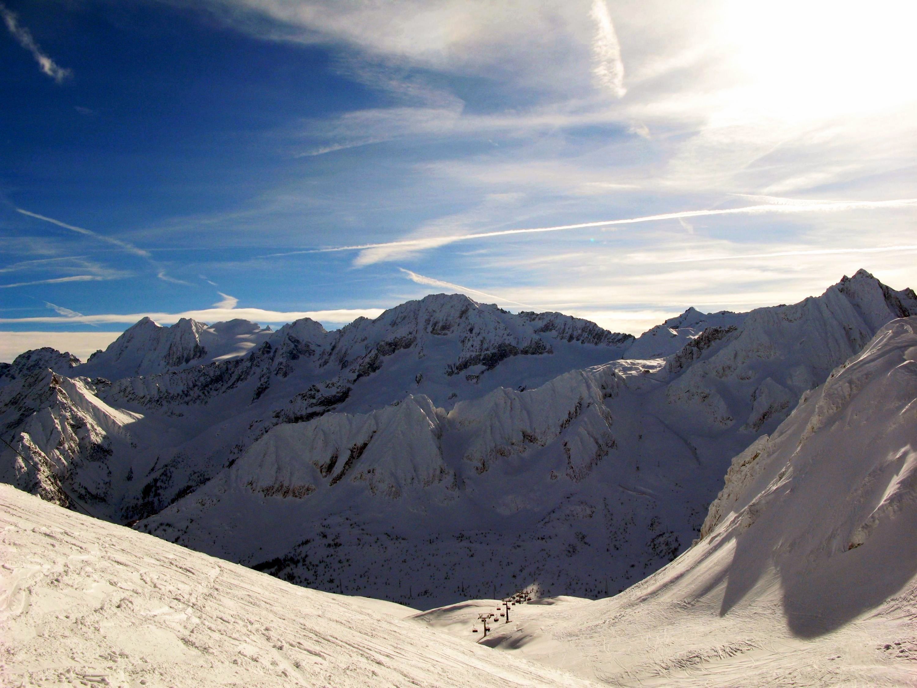 A snow-covered mountain range with clear skies.
