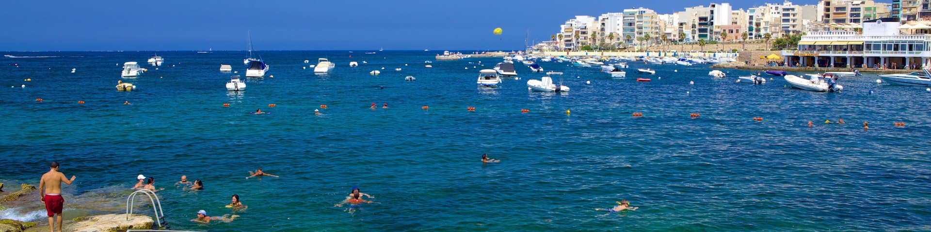 St. Paul\'s Bay featuring a coastal town, rugged coastline and a bay or harbour