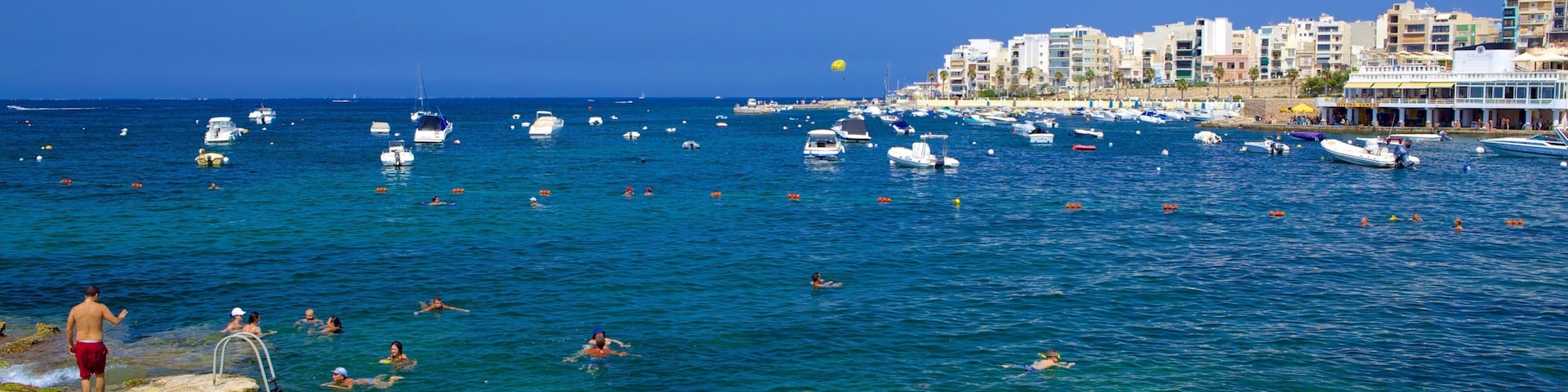 St. Paul\'s Bay featuring a coastal town, rugged coastline and a bay or harbour