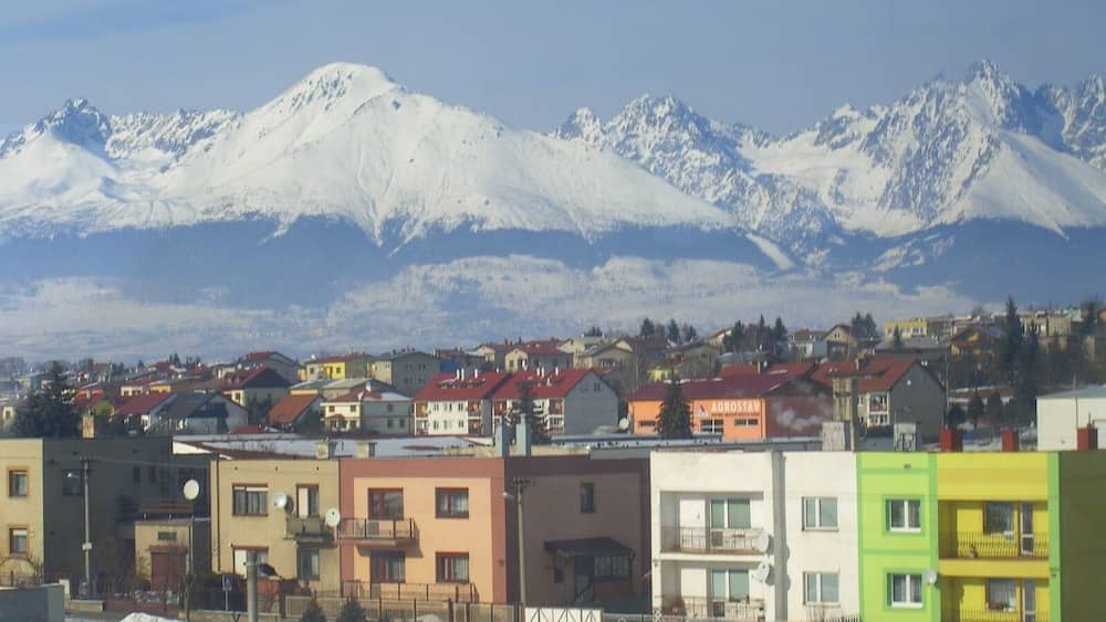 This was taken from Poprad railway station and shows some Poprad homes against a backdrop of the impressive High Tatra mountain range. #WinterWonders