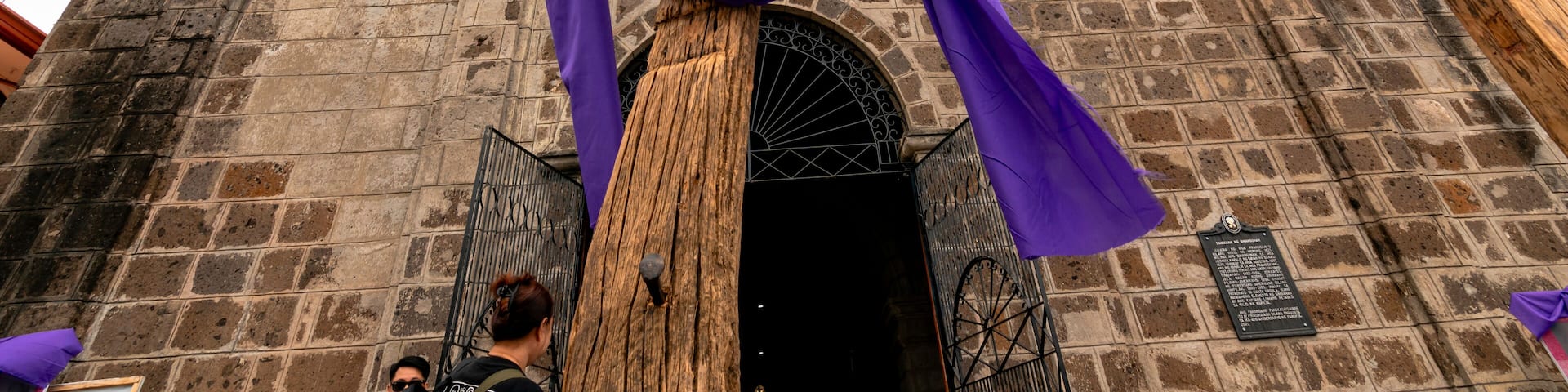 Binangonan, Rizal, Philippines - Crosses readied for Good Friday procession, in front of the facade of the Sta. Ursula Parish Church.