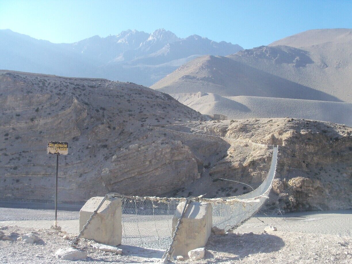 So peaceful, windy, where does this bridge lead too?